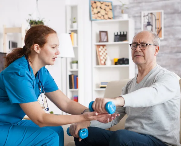 Therapist guiding a patient through an exercise